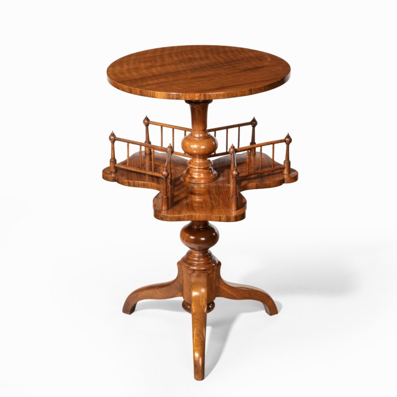 A Victorian walnut revolving book table