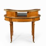 An unusual Victorian freestanding oval satinwood desk back