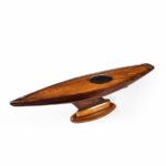An Unusual static model of a marble head pond yacht stood upon its original shaped oak stand.