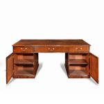 A late George III mahogany partner’s desk open sides