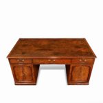 A late George III mahogany partner’s desk top