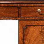 A late George III mahogany partner’s desk details