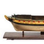 A carved and painted model of HMS Emerald, 1811 and ‘HMS Emerald and HMS Amethyst’ by Pocock side