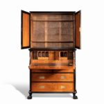 An Anglo-Chinese camphor and ebony campaign secretaire bookcase open