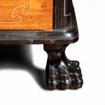 An Anglo-Chinese camphor and ebony campaign secretaire bookcase feet