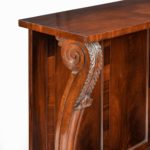 A pair of late Regency flame mahogany console tables