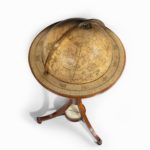 A pair of 12-inch floor globes by Cary stamp compass top