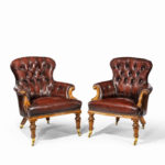 A pair of Victorian walnut library armchairs