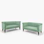 A pair of small Victorian window sofas