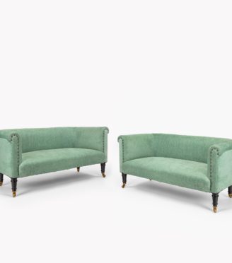 A pair of small Victorian window sofas