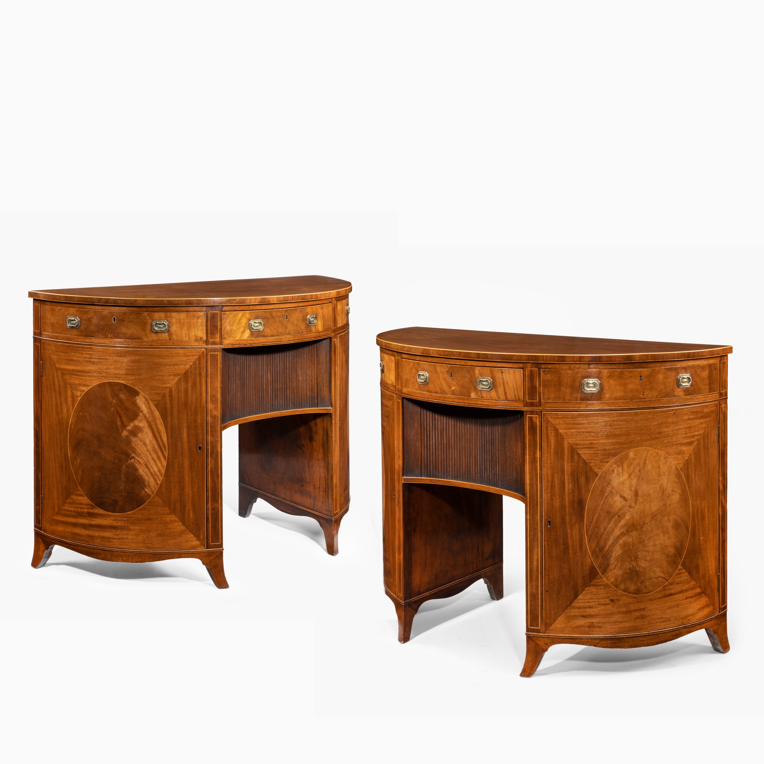 A fine pair of George III figured mahogany side cabinets, in the manner of Thomas Sheraton Main