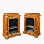 A pair of Victorian satinwood display cabinets attributed to Holland and Sons