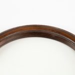 large George III gallery magnifying glass, the circular glass within a rosewood frame, the baluster handle screwing into a substantial brass bracket in the rim, inscribed ‘5 L & C’ Rim