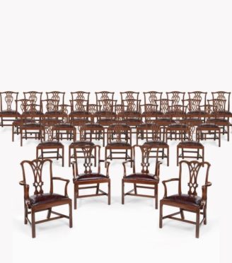 An extensive set of 34 mahogany chairs by Charles Baker, comprising four carvers and 30 side chairs