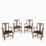 An extensive set of 34 mahogany chairs by Charles Baker, comprising four carvers and 30 side chairs side carvers