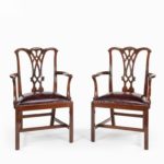 An extensive set of 34 mahogany chairs by Charles Baker, comprising four carvers and 30 side chairs side carvers