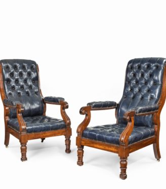 A pair of William IV mahogany and leather upholstered armchairs