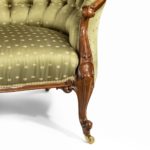 An elaborate Victorian shaped walnut sofa leg