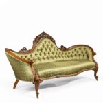 An elaborate Victorian shaped walnut sofa side