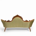 An elaborate Victorian shaped sofa back