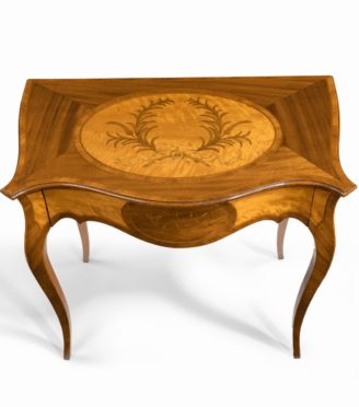 A Victorian inlaid satinwood and kingwood table in the style of Hepplewhite