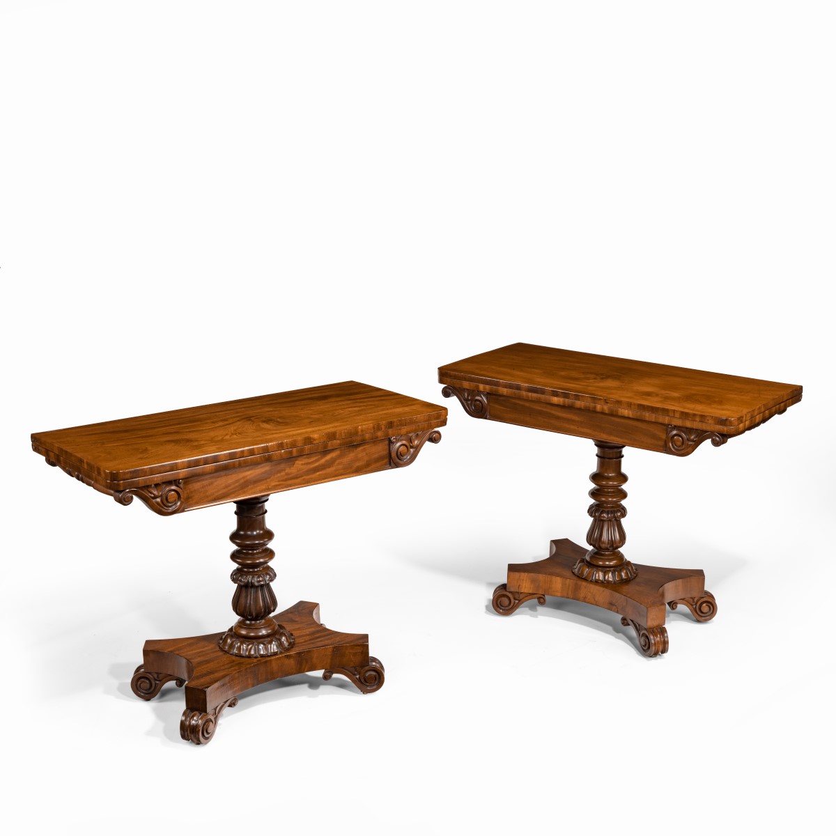 A companion pair of William IV flame-mahogany card tables