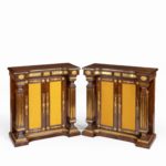 A pair of Regency brass-inlaid rosewood side cabinets