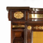 A pair of Regency brass-inlaid rosewood side cabinets detail