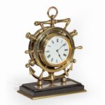 A brass ship’s novelty clock presented to Captain Tynte F Hammill