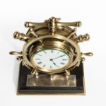 A brass ship’s novelty clock presented to Captain Tynte top