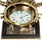 A brass ship’s novelty clock presented to Captain Tynte F Hammill RN