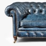 A Victorian 2-seater leather Chesterfield sofa side