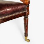 A rosewood library chair in the manner of Henry Holland made for the Senior Service Club leg