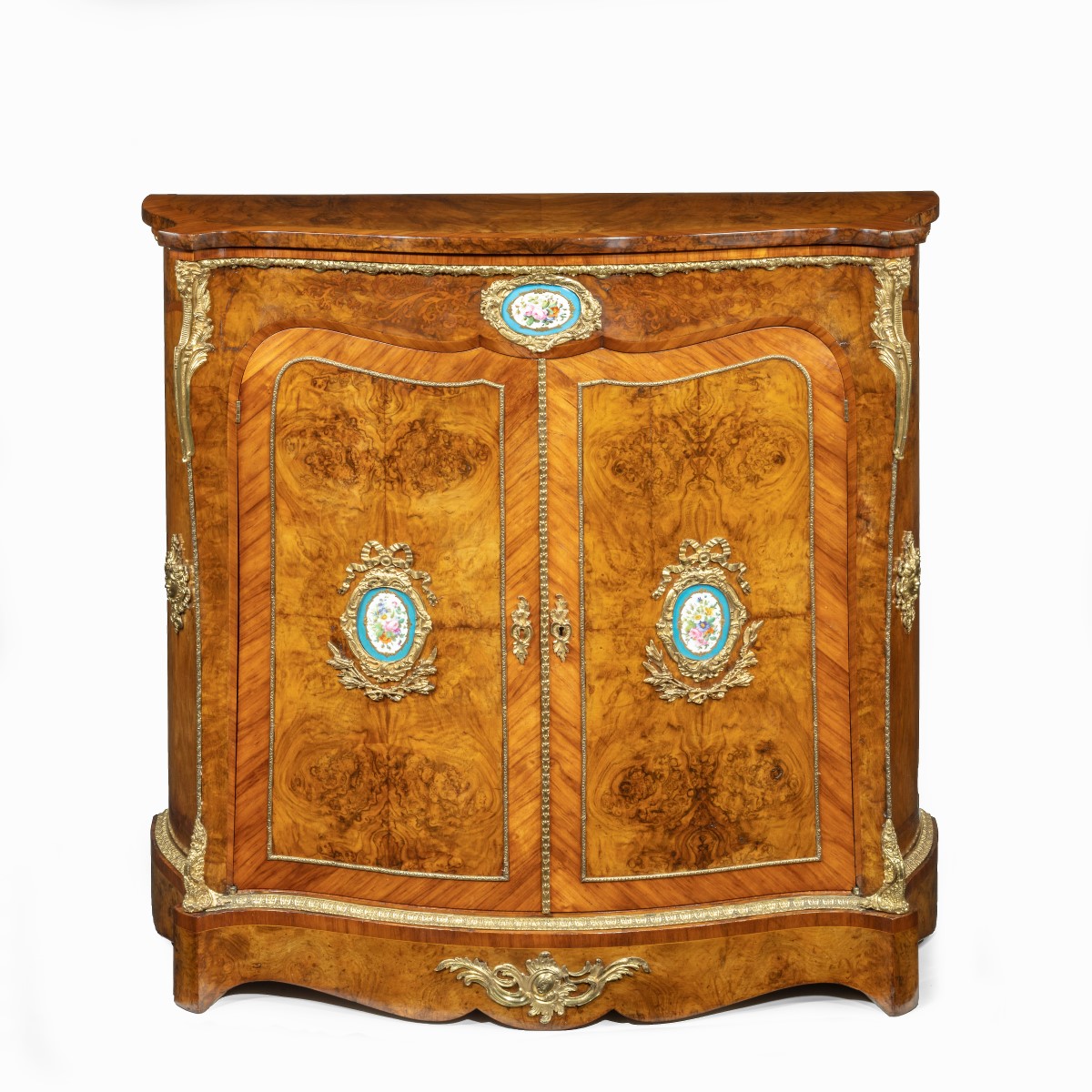 A Regency rosewood and gilt brass mounted book stand, attributed to Gillows
