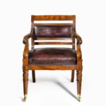 A mahogany library chair in the manner of Henry Holland reputedly made for the United Services Club