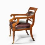 A mahogany library chair in the manner of Henry Holland reputedly made for the United Services Club