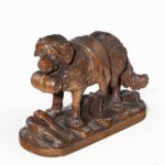 A ‘Black Forest’ carved linden wood model of a mount rescue dog
