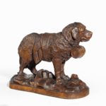 A ‘Black Forest’ carved linden wood model of a mount rescue dog