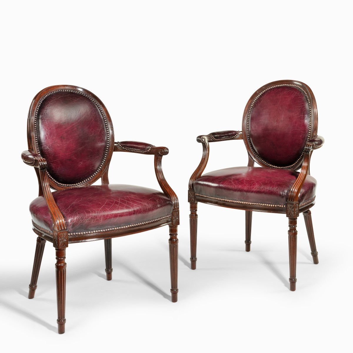 Two Edwardian mahogany chairs by Gill & Reigate