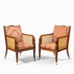 A pair of Regency mahogany bergère armchairs