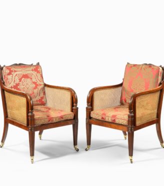 A pair of Regency mahogany bergère armchairs