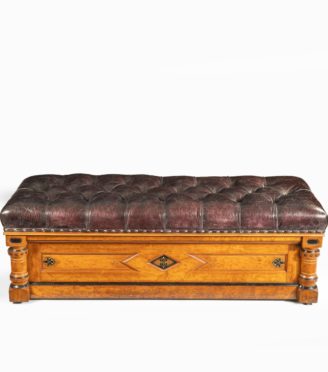 A Victorian walnut Ottoman in the Aesthetic style