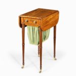 An elegant George III mahogany Pembroke sewing table down