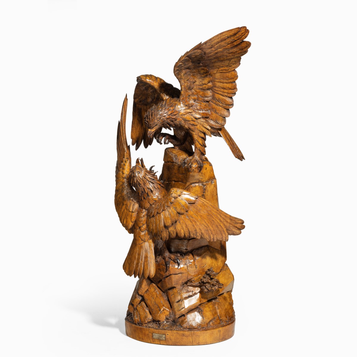 A ‘Black Forest’ carving of two quarrelling golden eagles
