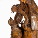 A ‘Black Forest’ carving of two quarrelling golden eagles close up details