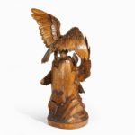 A ‘Black Forest’ carving of two quarrelling golden eagles back