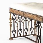 A Parcel gilt wrought iron stool attributed to Oscar Bach