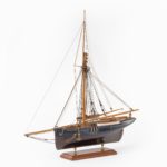 A shipyard model of a gaff-rigged Newhaven Smack, the hull carved