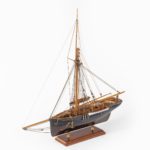 A shipyard model of a gaff-rigged Newhaven Smack, the hull carved