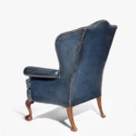Chippendale style leather wing armchair side profile